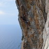 Climbing along the coast in Italy