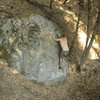 Ben Blair with left hand on the crux finishing hold.