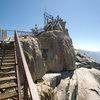 Currently, the stairs up to the fire lookout end abruptly, where the lookout once stood. There is 15 feet of 5.2 slab climbing from the last step to the top of the formation.<br>
<br>
For those climbing the Magician, it is now possible to walk down the stairs at any time, 7 days a week.