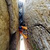 Peter Pribik following the chimney/finger crack pitch low on route.