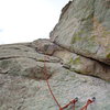 looking up at the recommended left exit for the 4th pitch. Hardest moves are right of the belay (5.8?) and then it eases up.