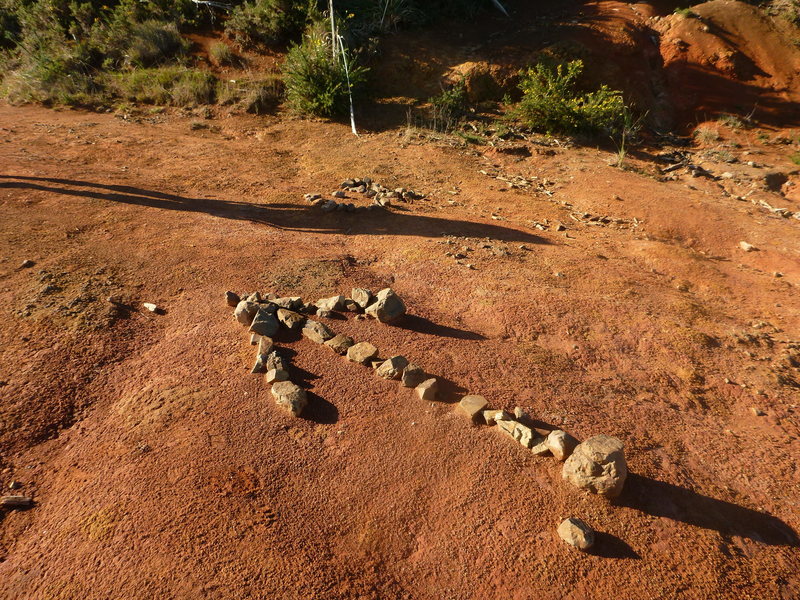 The stone arrow marking the start of the track