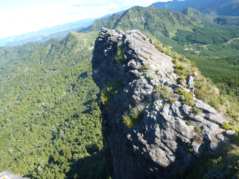 Climber at top of Quiet Earth Wall