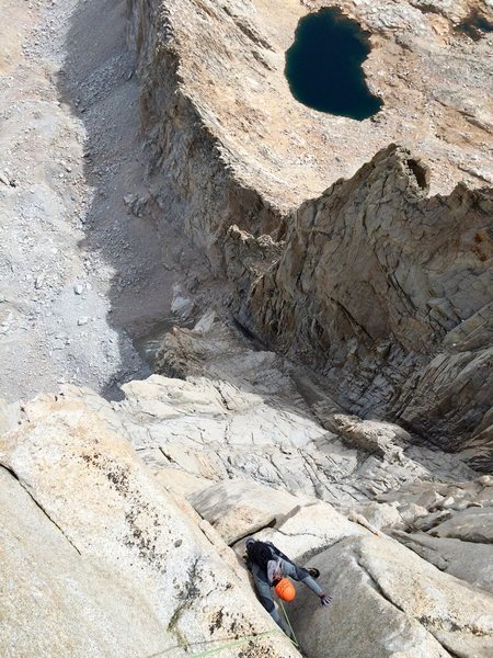 Topping out the headwall on P10 of the Beckey-Reese Direct. Pinnacle Ridge seen spilling out below.