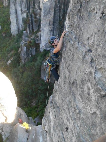 leading up Prachov's Needle. One bolt for the second pitch headwall (the belay bolt)