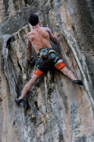 Elvis stemming the tufas on Tufa Two 5.12a, Iguana Wall