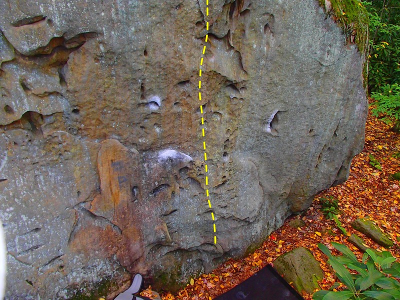 I messed around on this route earlier today next to an unlisted route that I like to call "Three Yodas" (see the Yoda head shaped pockets to the left?). It took a very specific sequence of moves that really forced you to emphasize footwork with little baby steps instead of big explosive moves. Start on a side-pull with your right hand and a flake with your left hand (highlighted in chalk). Place your right foot right exactly where the topo line begins and stand up. Quickly transition your left foot up onto a hold below the flake highlighted in chalk (where the rock looks more brown than gray) and reach your right hand up and around to a smear in the pocket across from the under-clung highlighted in chalk then grab said under-clung with your left hand and bring your right foot up into a pocket just right of the topo line and quickly move your left foot into a pocket that runs parallel to the one that you just put your right foot into. There is a pinch high right that will hold you for a long enough to find your next foothold in one of the many pockets that run up to the right of the topo. That's as far as I got before getting too pumped to finish. I will be back for sure. 