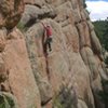 Chris Perkins sticks the lower crux of Man Hands.