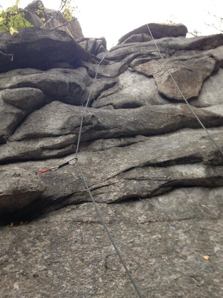 The rope and gear mark the climb.