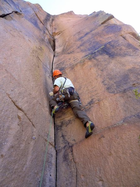 Josh heads up Isengard. The resting pod and the steep, crux lieback section at the top are visible. May 2014.