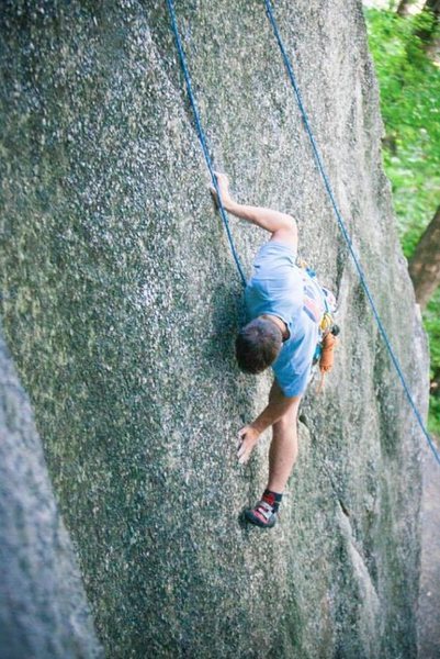 Entering the crux on the 5.10b/c variation on Pebbles