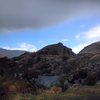 Picture of granite point from car parking lot.  Main area is near center of photo. 