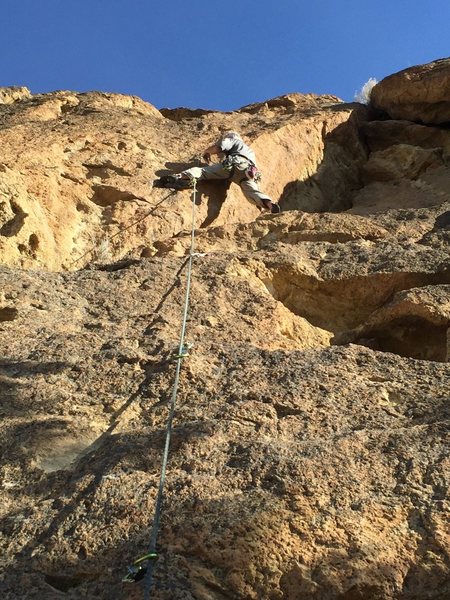 Traversing onto the face below the crux