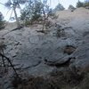 The lower part of the route as seen from just above the Royal Arch Trail. The scruffy and licheny east face.