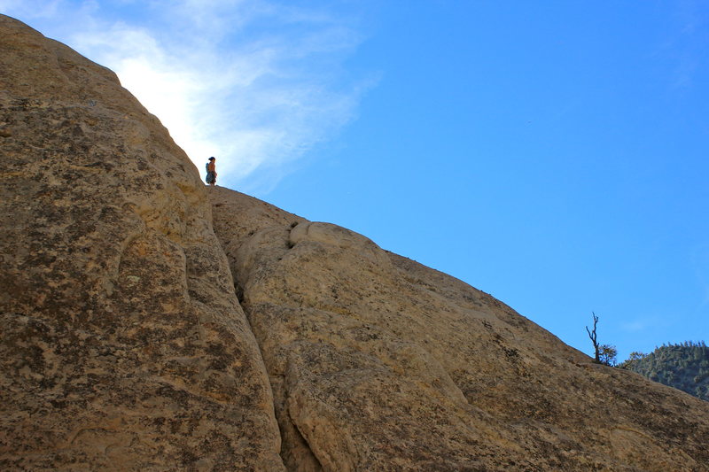 Behind me are two anchors to rap down. BECAREFULL because when you rap down and pull the rope, for it could get cammed in a crack on either side for the rappel. And the only way to get it is to solo up if that was your only rope. 60m makes it to the ground from the very top. Put knots at the end for added safety. 