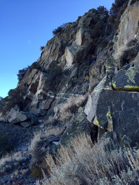 One of the 5th class diorite downclimbs on the descent. Photo: Johnny K