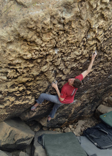 This is Zach climbing yet another boulder in a lost canyon someplace.  Cool looking rock, huh?