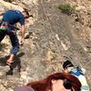 Lowering Jonny off of "Merci Augusto"(6c+).  Photo by Manu Lampo