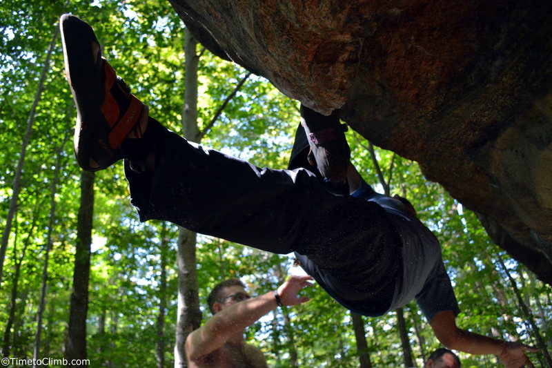 Mel Rivera hanging, foot flagged while bouldering "Ice Cold" a V7 traverse at Nine Corners Lake in the Adirondacks of NY. <br>
Read More - http://www.timetoclimb.com/bouldering/boulderingintheadirondacks/