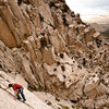 John Fisher moving just left of his namesake climb.