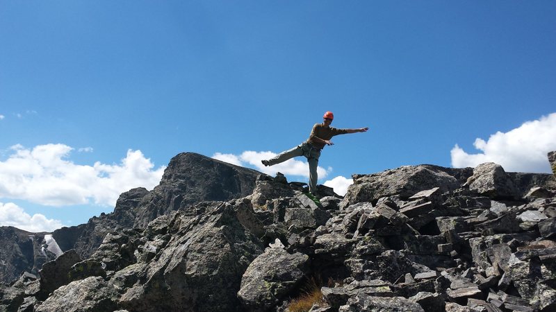 Mike Walley being blown away by very calm winds - on top of Sharks Tooth in RMNP. Early Fall 2015.