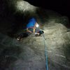 Placing the #1 ball nut to protect the lower crux.