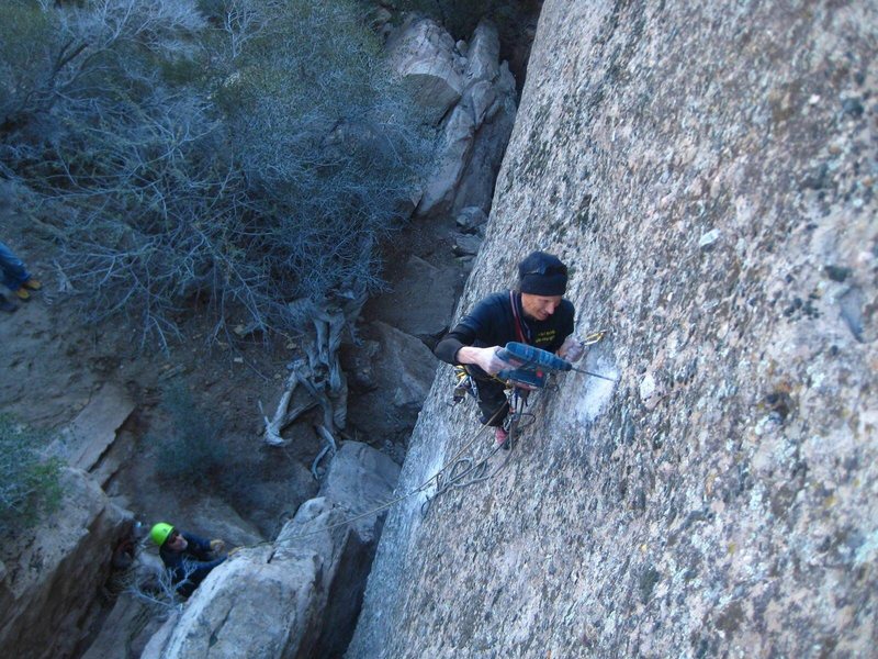 Jeff Constine re-bolting No Philosophy. Start on the ledge below this climber.