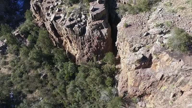 Drone shot of Lori climbing Never Forget