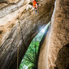 Batman Can't Fly. Photo is at the crux, transitioning from the hand crack to the roof. I find it easiest to traverse to the far end of the chimney, where it is wider, then squeeze through there. 