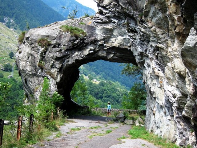 Tunnel through the rock on the old road at Vho