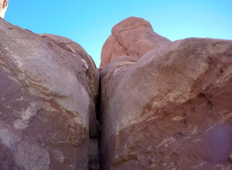 Looking up at the off width to finger crack on the start of the 3rd pitch