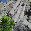 The two pitches of MX can be linked into one 210 foot pitch. This photo is taken from the base. John is high on the second pitch.