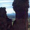 Rap from above panic point.  There are large rings (3 inch?).  One 70m rope will reach the notch and allow a second rap to ground from another set of chains, or 2x60m will reach the ground with plenty of extra from the rap above panic point.  