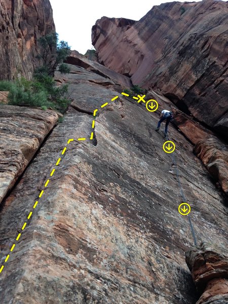 Rappelling down after completing the climb. The rappel line goes right through another bolted route to the right of this one.  