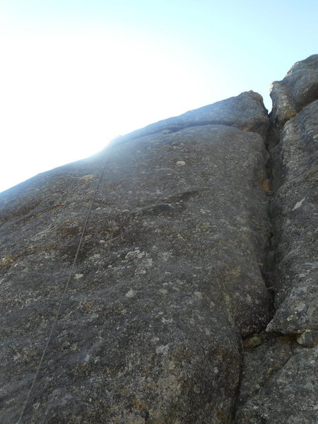 Tenuous-5.10. Short but sustained and challenging slab-- probably in the 5.10c/d range. Thin, thin, thin...