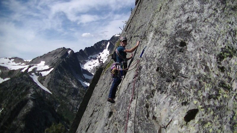 Jeremy leading out the 5th traverse pitch, with the added bolt for protection.