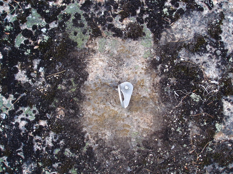 New-ish 3/8" bolt on the slab directly above the P1 belay of "Gawking". Most of the slab below and above this has quite a bit of lichen. (Immediate area around the bolt was brushed 2016)