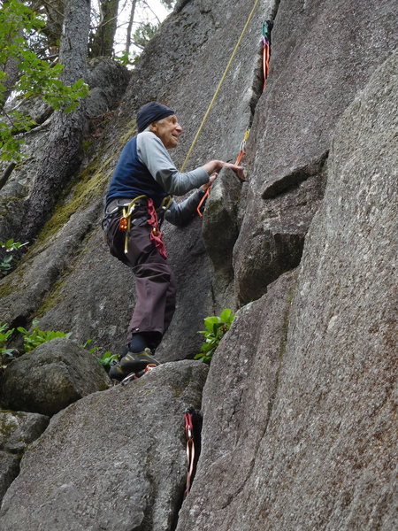 Fred Beckey out having fun on some rock.