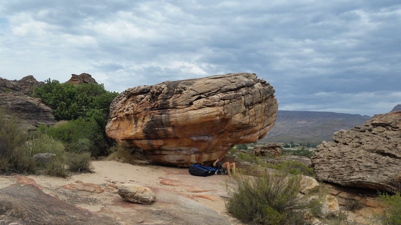 Poison Dwarf climbs directly out the center of the boulder. The direct variation breaks off to the right after the large sloping rail.