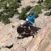 Site developers Craig (Rudy) Martin, Jersey Dave Littman, and Julia Salmi on a large belay ledge 