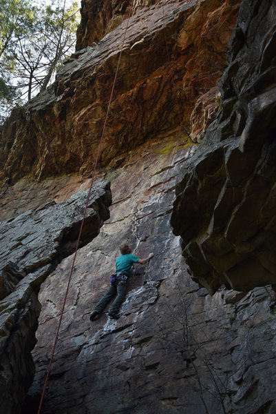 Fantastic face climbing beneath the main over look, WARNING: without placing gear under the lower roof to redirect the top-rope a fall will very likely result in the climber slamming into the fin of rock that’s behind them.  North East Area