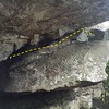 Alternate Boulder Start: begin in the carbonized corner  of the Rock and find the few good handholds; pull up and traverse the boulder using decent smears and a few dishes, handholds are fairly well spaced. Throw high hands in to the chockstones and mantel up, then proceed into the chimney like normal. I'd probably call it a 5.8 start if I had to guess, but it also seems a little less sketchy than the entrance directly below the chimney. I'd still belay from the same spot and not place gear in until in the chimney proper. 