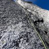 Pitch 7 (5.9 crack variation to left of chimney). This pitch got harder higher up, so we made a delicate traverse to the right back into the chimney system.