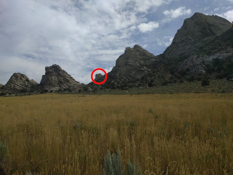 Picture of the White Lightning crag taken from the twin track dirt road facing North East.