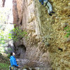 climbing near the entry to the canyon... this is the 5.10a I think.