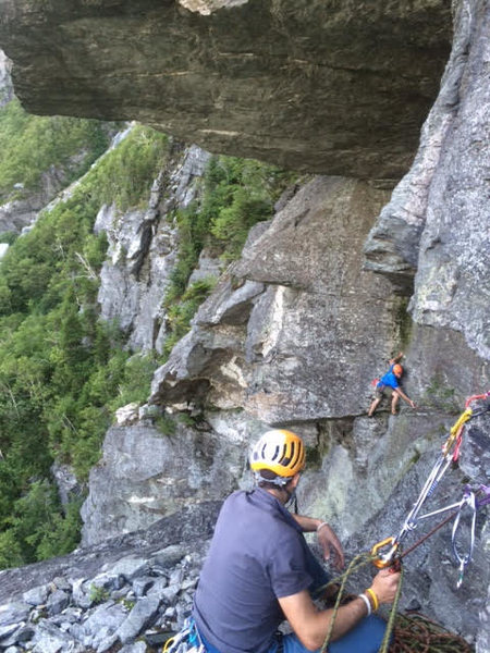 P4, traversing too early.  Don't go this way!  You're supposed to be up about 15 ft. higher into the corner above where this climber is, directly under the massive roof above.