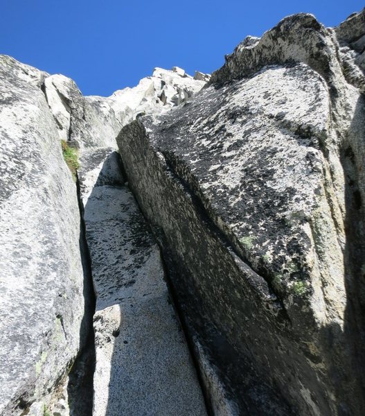 I suspect this is the 10+ crack (60-70' into P2) that Erroneous & co climbed.  We went right at this point instead of climbing the crack.