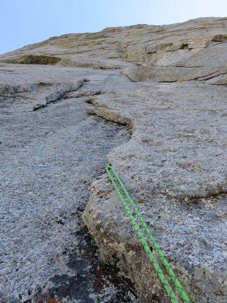 Pitch 3.  This pitch follows the corner system up to a ledge. The corners on the route are slabby corners, which involve trusting foot smears rather than jamming.