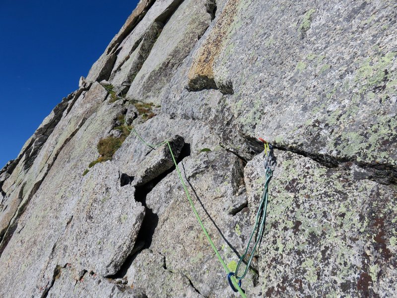 The route ends by traversing this diagonal weakness across the face to the summit ridge.