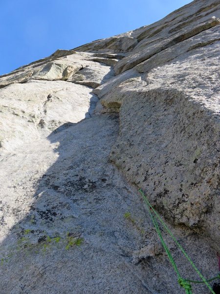 Pitch 8. This pitch climbs the groove feature. There are some thought-provoking sections and tenuous steps first to the left and then back to the right. The climbing is pretty sustained 5.8 with some no-fall moves above gear.